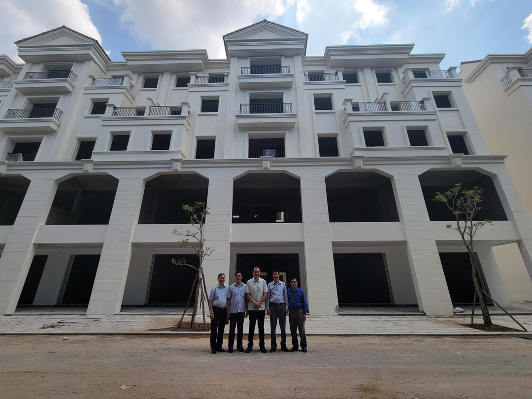 reSource's Hua-Soo with the Hanoi Bible College leadership time in front of the new campus.